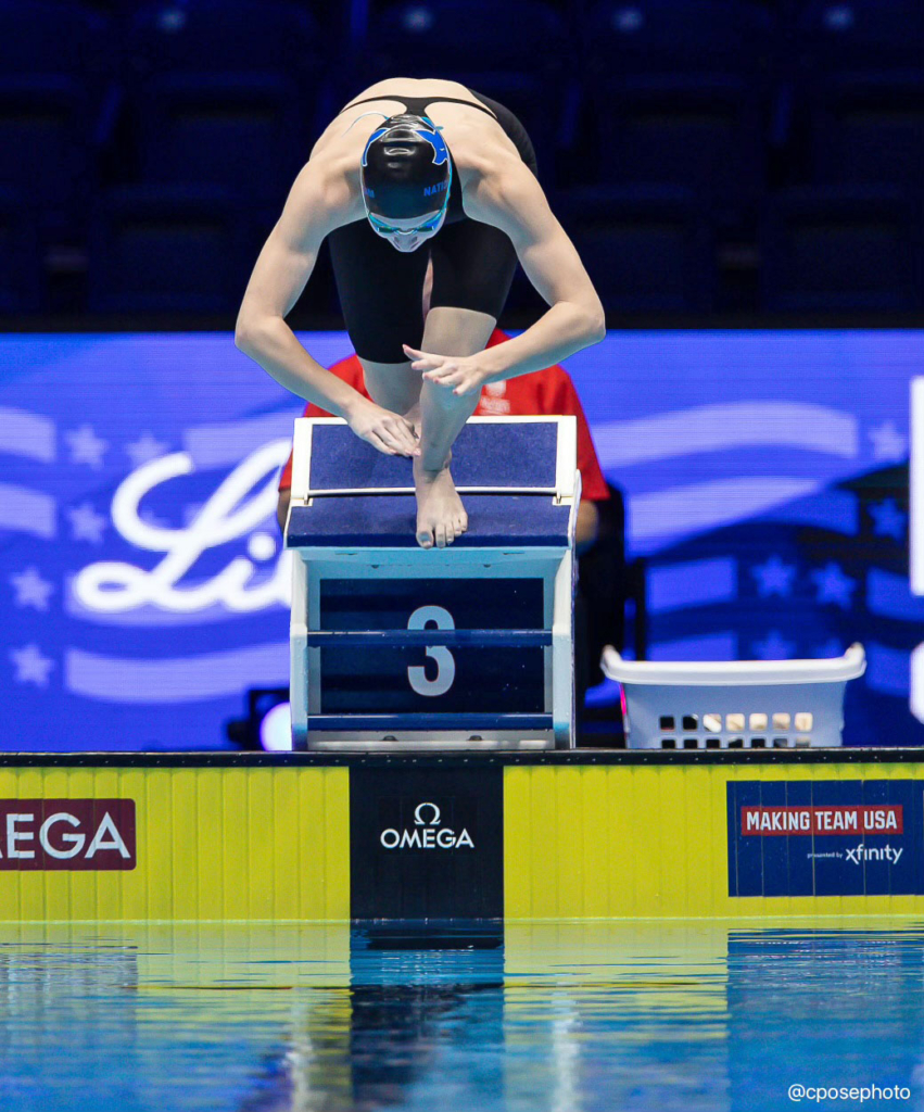 Caroline Larsen pushes off the starting block in the 100 Freestyle race at the U.S. Olympic Trials. Photo by Chris Pose June 2024