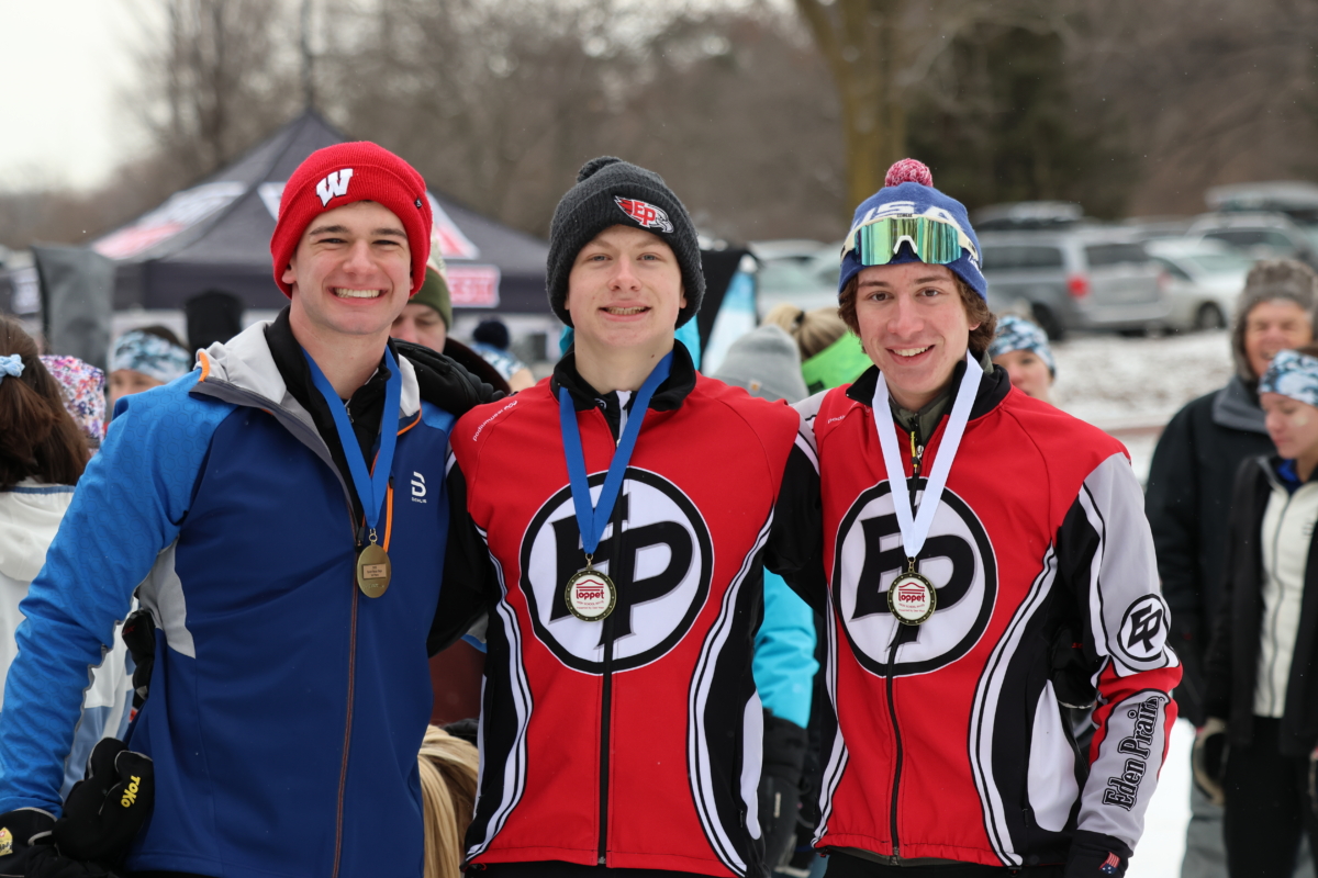 3 young men skiers pose with their medals